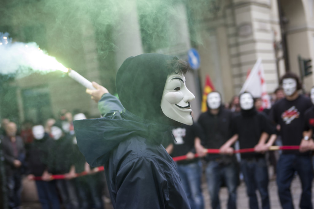 Supporters masked as Anonymous, acting during the 1 may celebrat